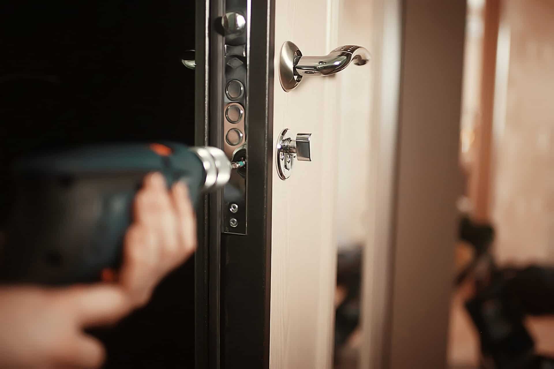 Locksmith picking door lock